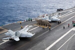 An E/A-18G Growler (left), assigned to the "Gray Wolves" of Electronic Attack Squadron (VAQ) 142, and an F/A-18E Super Hornet, assigned to the "Tomcatters" of Strike Fighter Squadron (VFA) 31, prepare to launch from the Electromagnetic Aircraft Launching System on the first-in-class aircraft carrier USS Gerald R. Ford's (CVN 78) flight deck, on March 10, 2023 while it is underway in the Atlantic Ocean. (Photo: U.S. Navy by Mass Communication Specialist 3rd Class Grace Lyles)