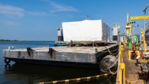 A grand block for DDG-135 arrives by barge for final integration at HII’s Ingalls Shipbuilding division in August 2025 after being constructed, inspected and accepted at Eastern Shipbuilding Group’s Nelson Facility. (Photo: Eastern Shipbuilding Group)