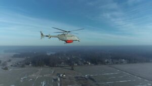 An MQ-8 Fire Scout, with mass shapes attached, conducted low airspeed flying qualities testing in February 2022 at Webster Field, Md. to prepare for upcoming the Single System Multi-Mission Airborne Mine Detection (SMAMD) demonstration. (Photo: U.S. Navy)