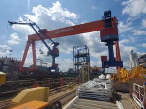 Hanwha Philly Shipyard's Dock 4 with its goliath crane in July 2025 after the South Korean conglomerate bought the yard at the start of the year. (Photo: Defense Daily)
